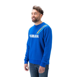 Simple mais contrasté, le sweat-shirt Faster Sons ras du cou pour homme est fabriqué dans un mélange de tissus bio et recyclés incroyablement doux. Sa dominante bleu racing, son logo Yamaha imprimé au centre et ses bandes Heritage sur l'épaule gauche qui rappellent l'histoire de Yamaha en compétition, s'accordent à la gamme Sport Heritage. Le confort et l’effet usé en font un vêtement au style rétro, parfait pour tous les jours.